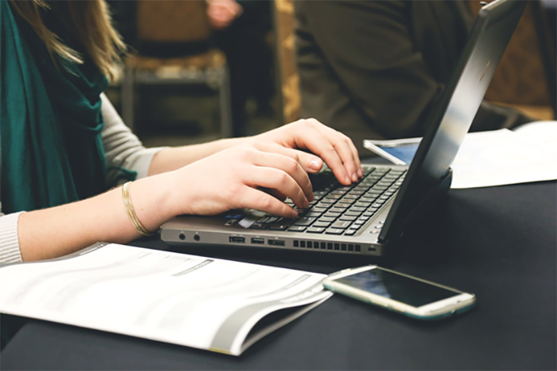 A woman working on her laptop