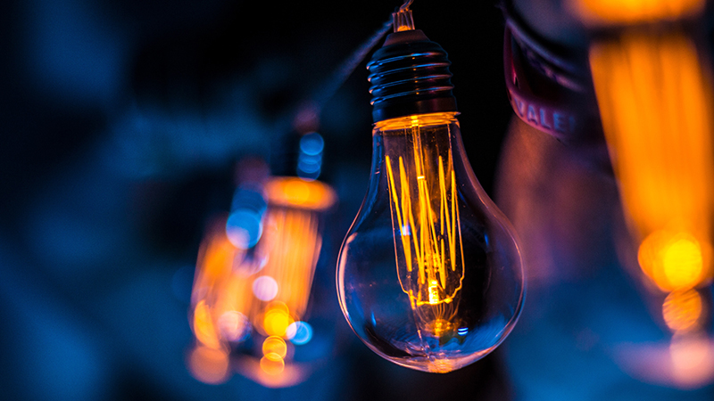 light bulb in a dim blue background