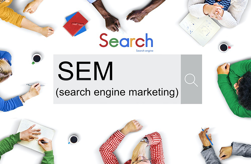 search engine marketing concept on a white table surrounded by people