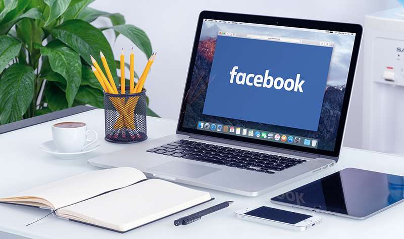 Facebook new logo on the Apple MacBook Pro Retina with an open tab
