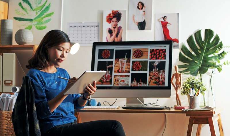 Young woman working on tablet at office