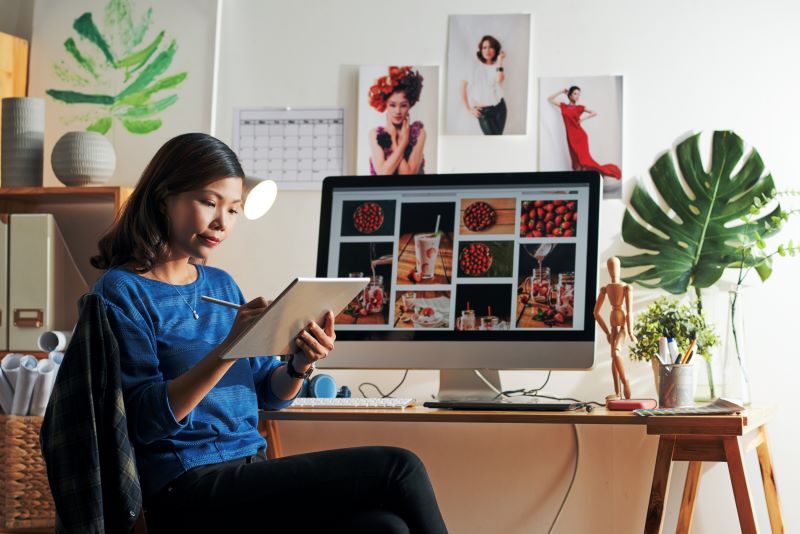 Young woman working on tablet at office