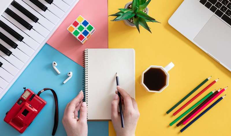Blank notepad on colored background, creativity concept