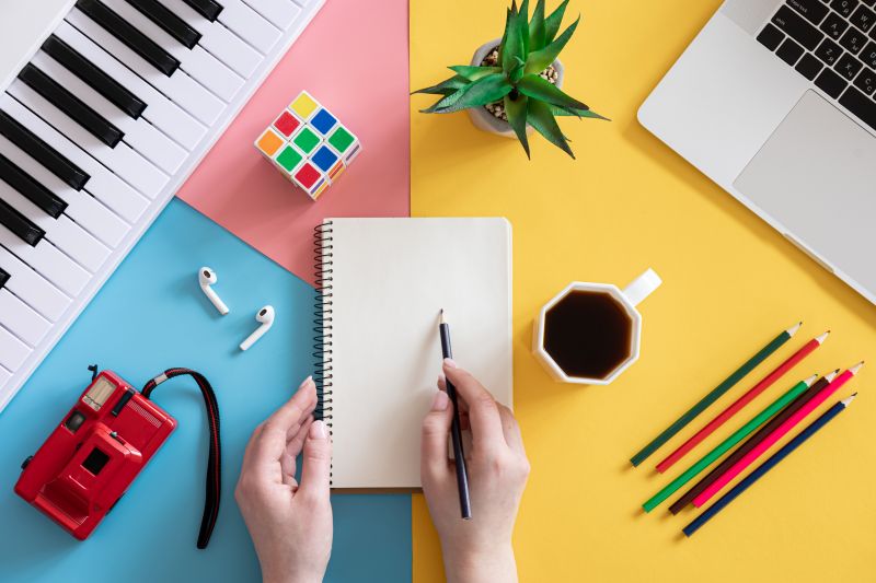 Blank notepad on colored background, creativity concept