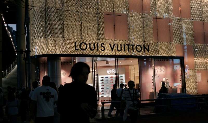 louis vuitton store exterior at night with people