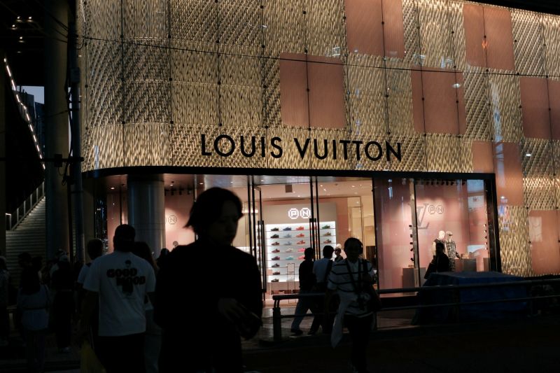 louis vuitton store exterior at night with people